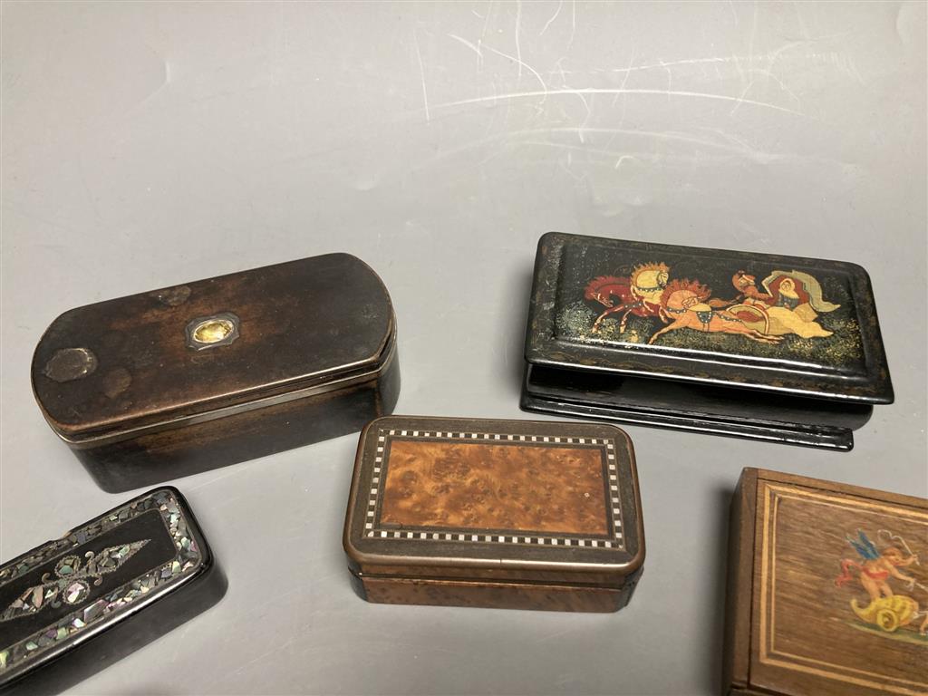 A collection of snuff boxes, mostly 19th century, including horn, tartan, mauchline, black papier mache and other treen